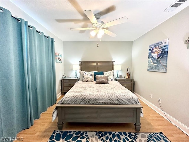 4563 SE 5th Pl Unit 205, Cape Coral, FL 33904 - bedroom featuring ceiling fan, baseboards, light wood finished floors, and visible vents