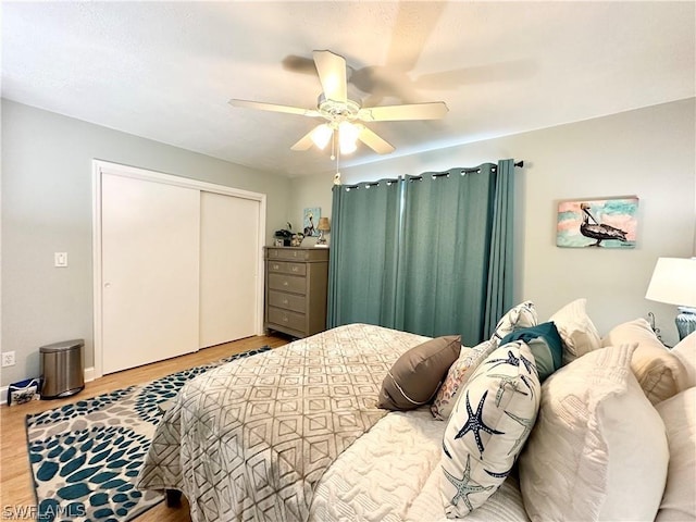 4563 SE 5th Pl Unit 205, Cape Coral, FL 33904 - bedroom featuring a closet, wood finished floors, and a ceiling fan