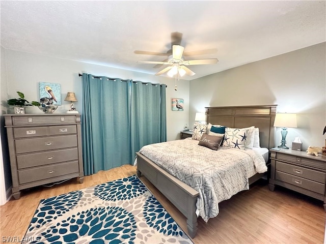 bedroom featuring wood-type flooring and ceiling fan