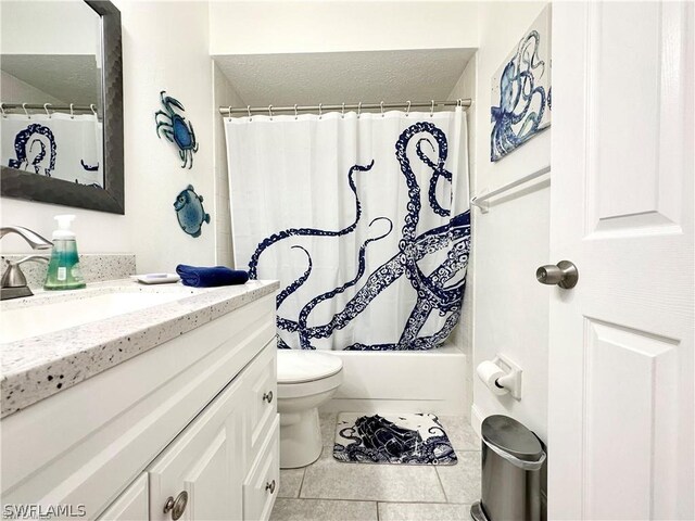 4563 SE 5th Pl Unit 205, Cape Coral, FL 33904 - bathroom featuring tile patterned flooring, vanity, toilet, and shower / bathtub combination with curtain