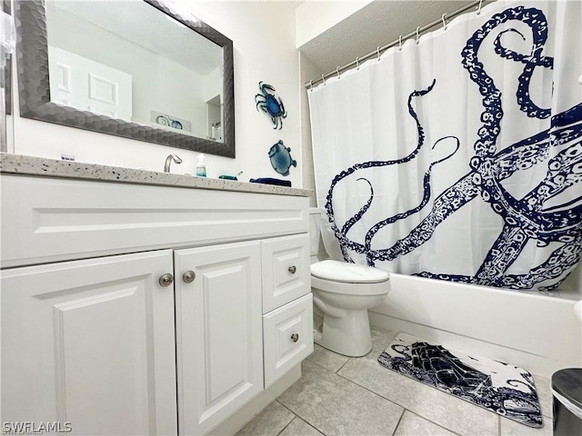 4563 SE 5th Pl Unit 205, Cape Coral, FL 33904 - full bathroom featuring toilet, vanity, tile patterned floors, and shower / bath combo