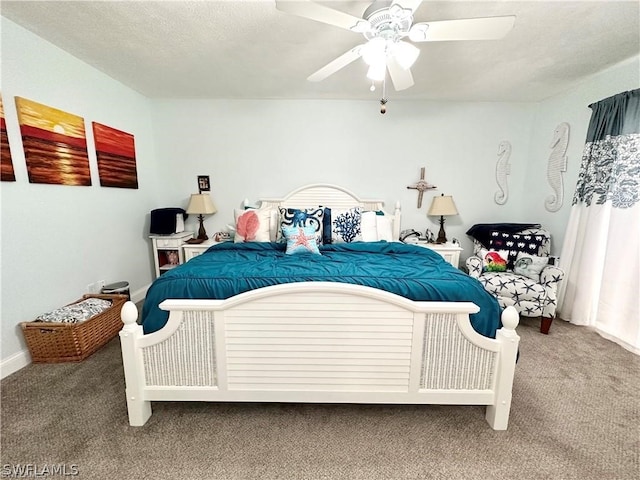 carpeted bedroom featuring a textured ceiling and ceiling fan