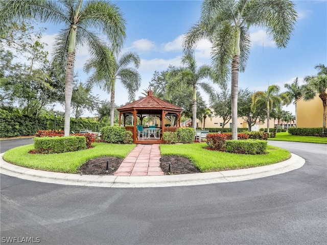 surrounding community with a lawn and a gazebo