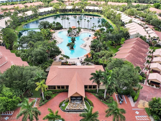 birds eye view of property featuring a water view and a residential view