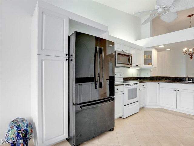 kitchen featuring white cabinets, ceiling fan with notable chandelier, black refrigerator, sink, and white range with electric stovetop