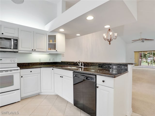 kitchen with black dishwasher, white cabinetry, electric range, and sink