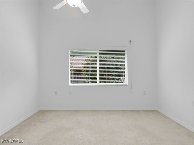 empty room with light carpet and ceiling fan