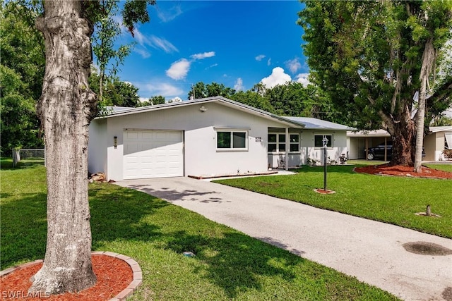 ranch-style home with a front yard and a garage