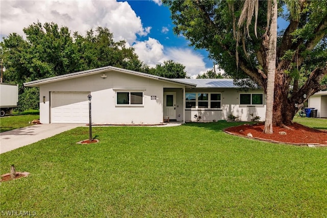 ranch-style house featuring a garage and a front lawn