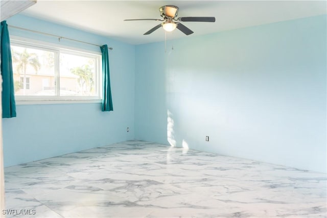 empty room featuring ceiling fan