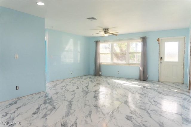 empty room featuring ceiling fan