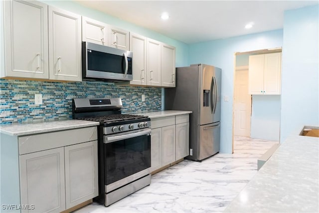 kitchen featuring decorative backsplash and stainless steel appliances