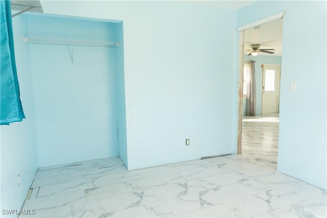 unfurnished room featuring ceiling fan