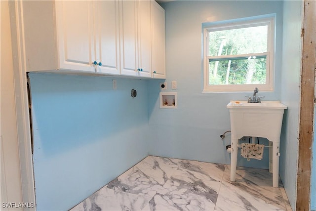 washroom with washer hookup, cabinets, and hookup for an electric dryer