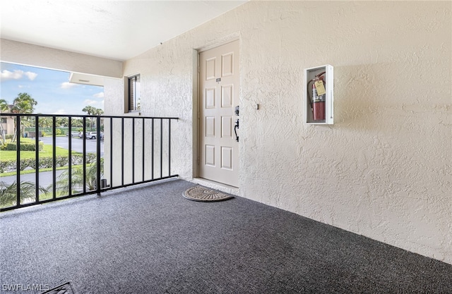 entrance to property with a balcony