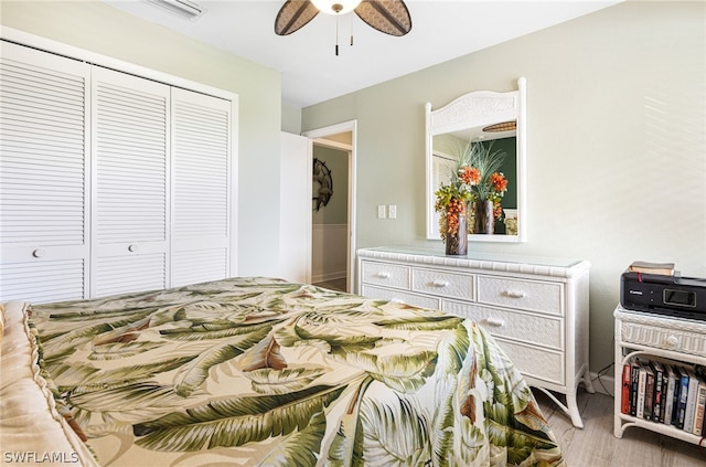 bedroom with ceiling fan and a closet