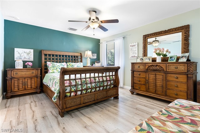 bedroom with ceiling fan and light wood-type flooring