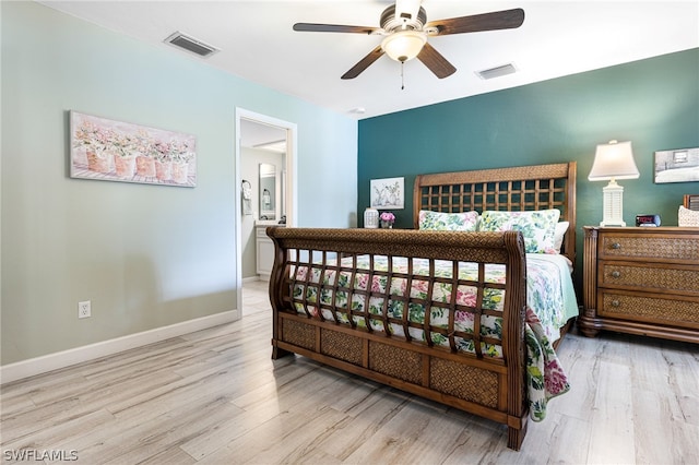 bedroom with light hardwood / wood-style floors, ceiling fan, and ensuite bathroom