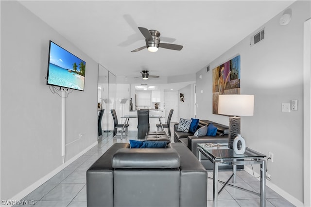 tiled living room featuring ceiling fan