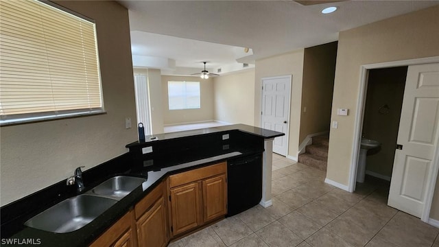 kitchen featuring light tile patterned flooring, black dishwasher, ceiling fan, and sink