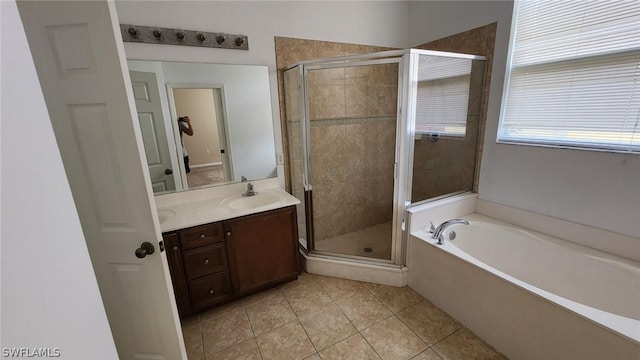 bathroom featuring vanity, tile patterned flooring, and plus walk in shower