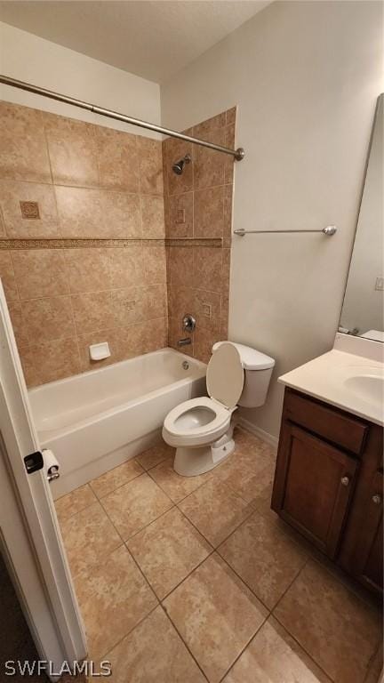 full bathroom with tiled shower / bath combo, toilet, and vanity