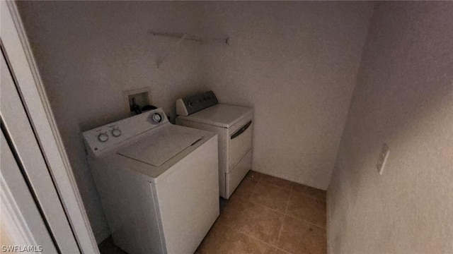 laundry area featuring washing machine and clothes dryer