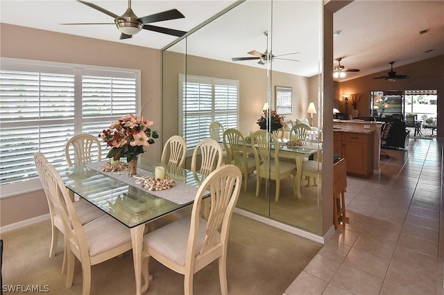 dining room with tile patterned flooring, plenty of natural light, and ceiling fan