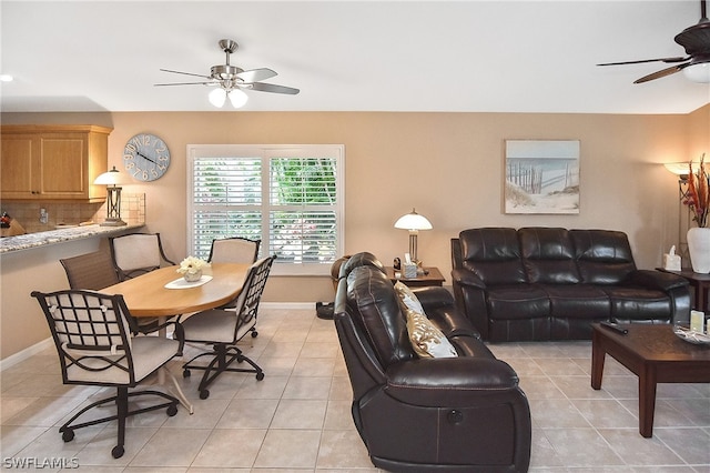 tiled dining space with ceiling fan