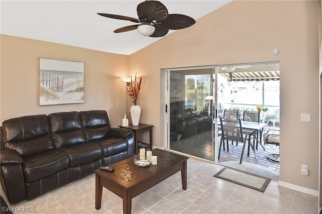 tiled living room with ceiling fan and vaulted ceiling