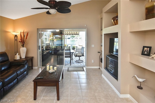 tiled living room with lofted ceiling and ceiling fan