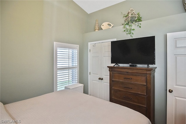 bedroom with a closet and vaulted ceiling