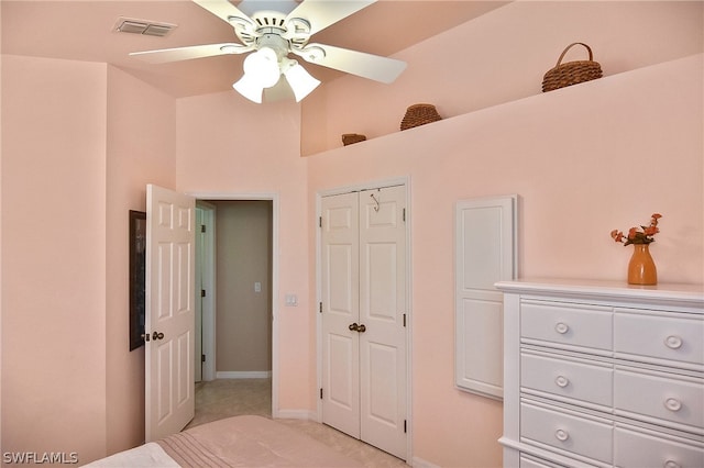 bedroom featuring light tile patterned floors and ceiling fan