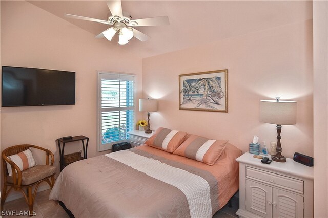 bedroom with ceiling fan and tile patterned floors