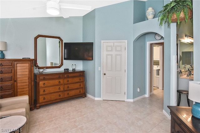 interior space featuring ensuite bath and ceiling fan