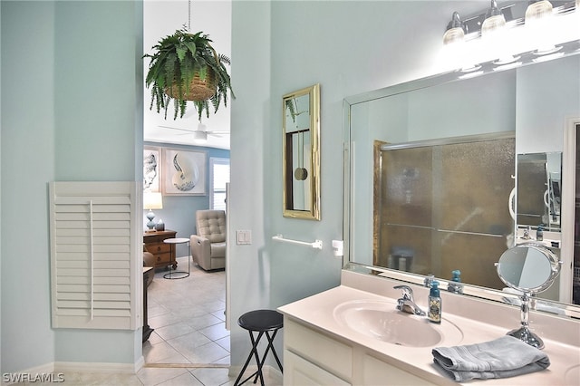 bathroom featuring tile patterned flooring and vanity