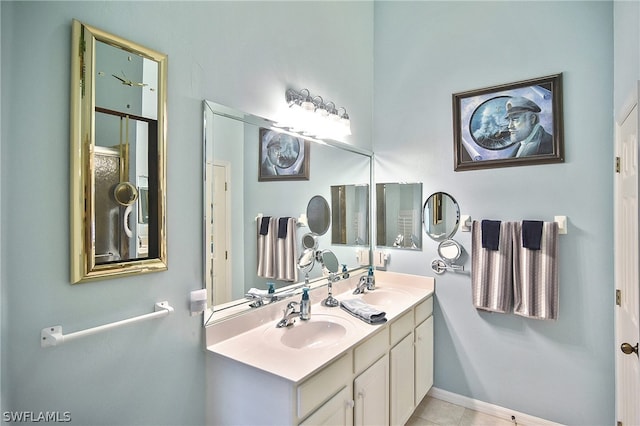 bathroom featuring dual vanity and tile patterned flooring