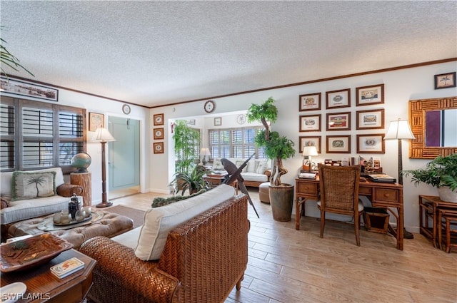 living room with light hardwood / wood-style floors, crown molding, and a textured ceiling