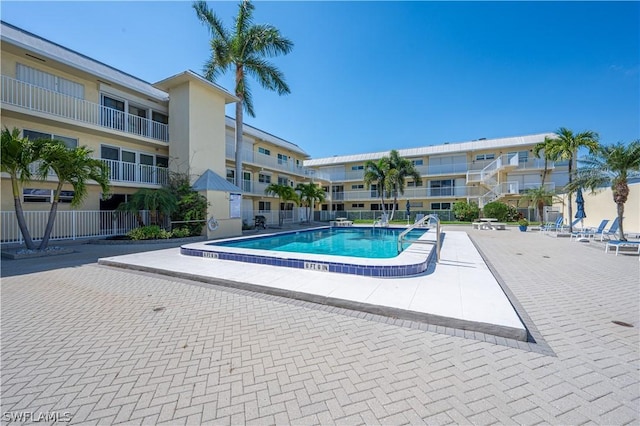 view of swimming pool with a patio