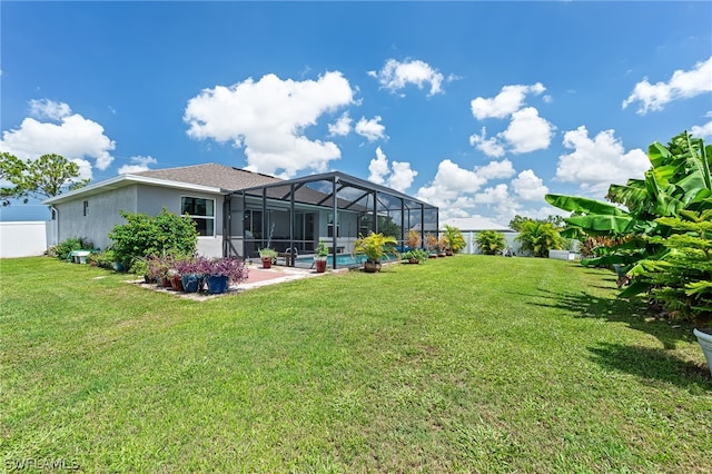 view of yard featuring a patio and a lanai