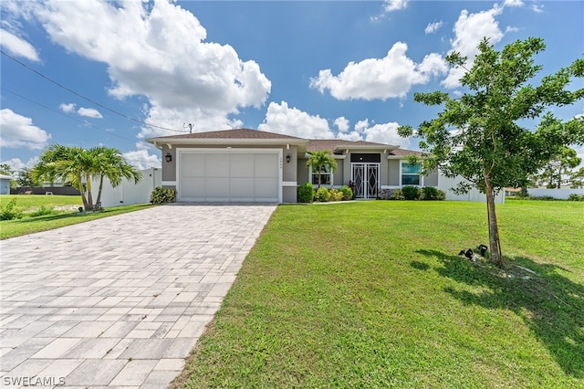 ranch-style home with a garage and a front lawn