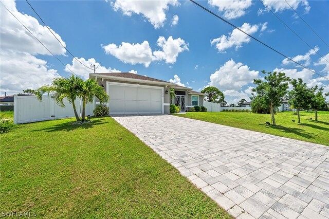 view of front of property with a garage and a front lawn