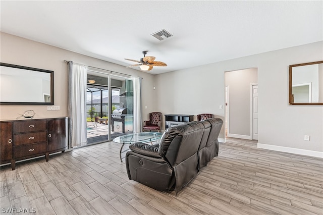 living room with ceiling fan