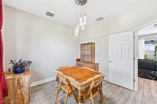 dining room with light hardwood / wood-style flooring