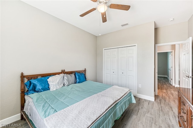 bedroom featuring a closet, ceiling fan, and light hardwood / wood-style flooring