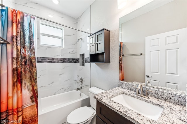 full bathroom featuring shower / bath combo, vanity, and toilet