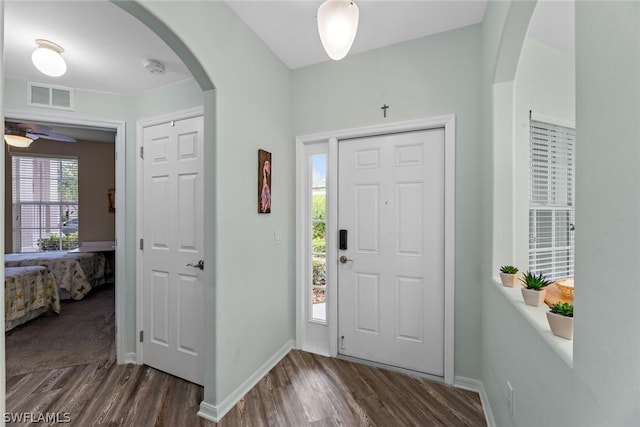 entryway featuring ceiling fan and dark wood-type flooring