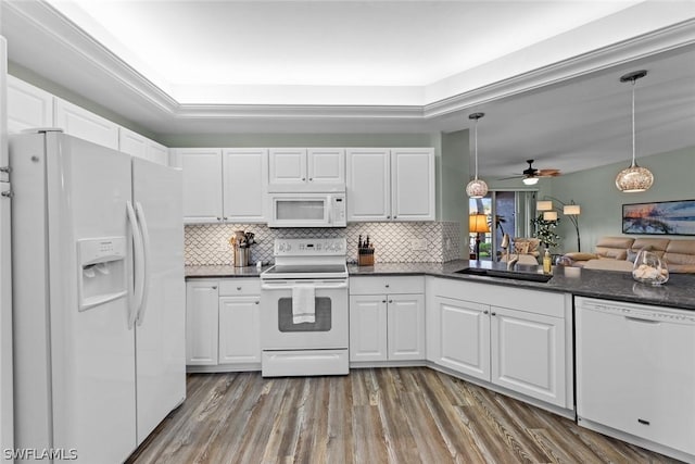 kitchen with white appliances, white cabinets, sink, ceiling fan, and decorative light fixtures