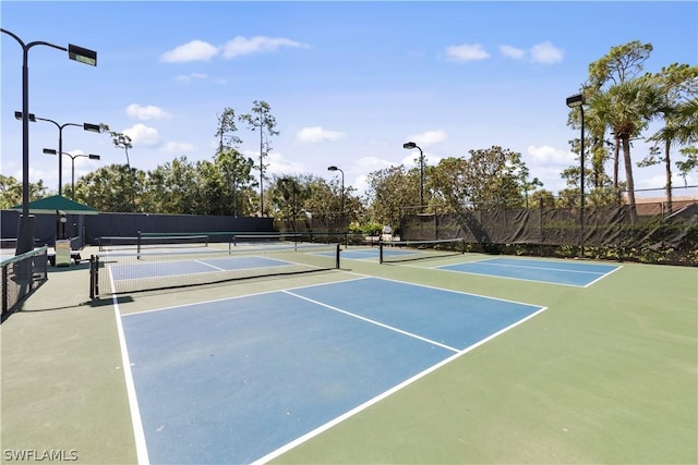 view of sport court with basketball hoop