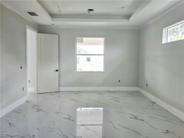 4111 22nd St SW, Lehigh Acres, FL 33976 - unfurnished room featuring a tray ceiling and baseboards